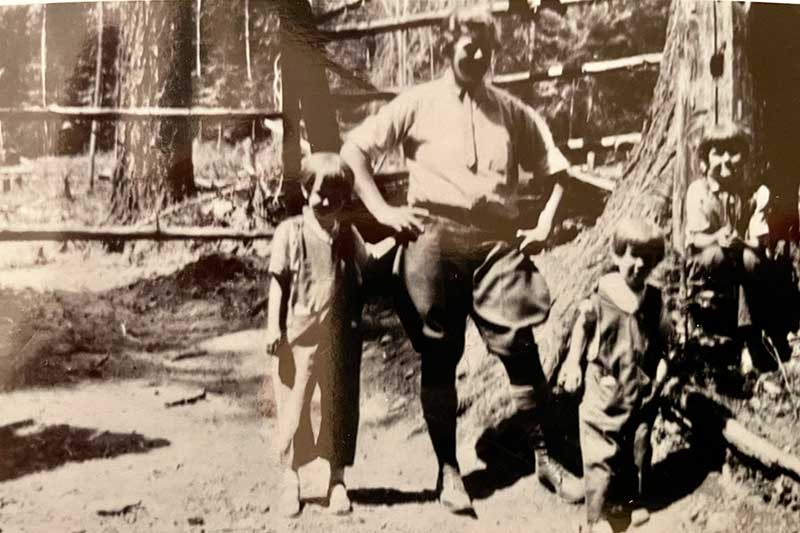 old time photo of man and children