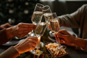 champagne glasses being clinked together