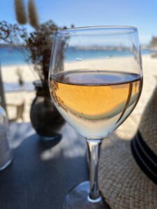 Glass of rosé glimmering in sunlight