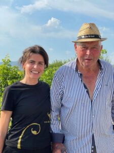 Italian father and daughter standing in the organic and biodynamic vinyard of Casa di Baal in Campania Italy